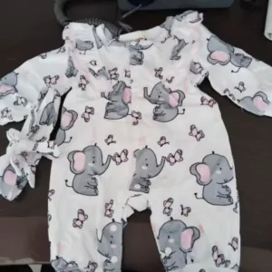 Dlouhoruký overal s nápletem obdržený od zákazníka A***n.