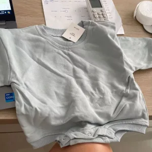 We received a long cotton romper for babies from customer R**o.